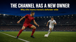 Wide centre-back stepping wide to intercept a counter in the right channel at blue hour